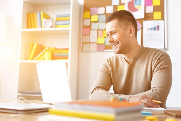 Young guy studying at home — Stock Photo, Image