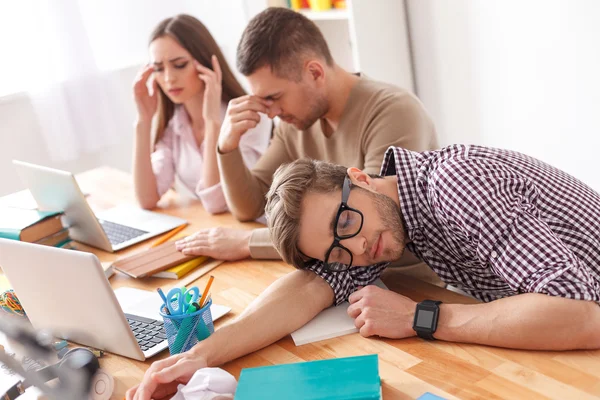 Young students studying for exams at home — Stockfoto