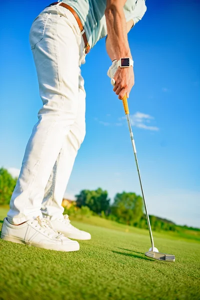 Jugador de golf sosteniendo clud —  Fotos de Stock