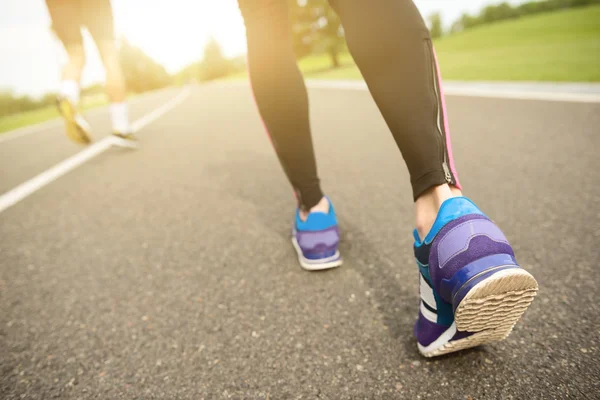 Aspirated man and woman running together — Stock Photo, Image