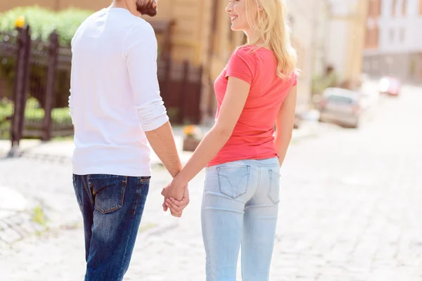 Happy lovers walking in city — Stock Photo, Image