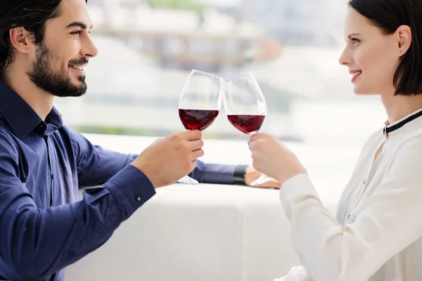 Pretty lovers drinking wine while celebration — Stock Photo, Image