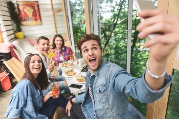 Friends having fun during lunch together — Stock Photo, Image