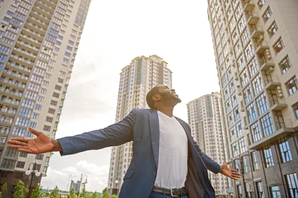 Joyful man relaxing in town