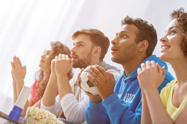 Group of multi national football fans cheering