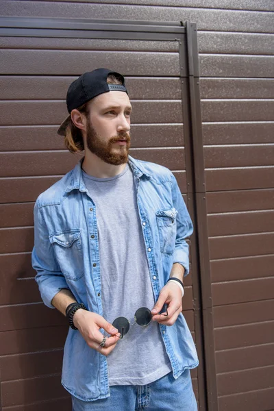 Cheerful guy standing in expectation — Stock Photo, Image