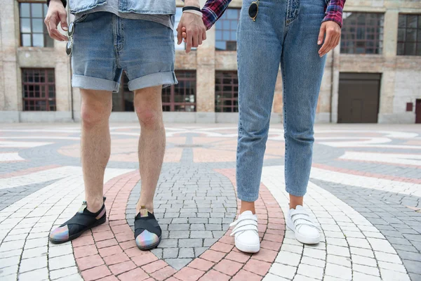 Young hipsters walking in town