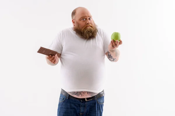 Fat guy making choice of food — Stock Photo, Image