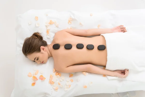 Relaxed girl receiving massage at beauty salon — Stock Photo, Image