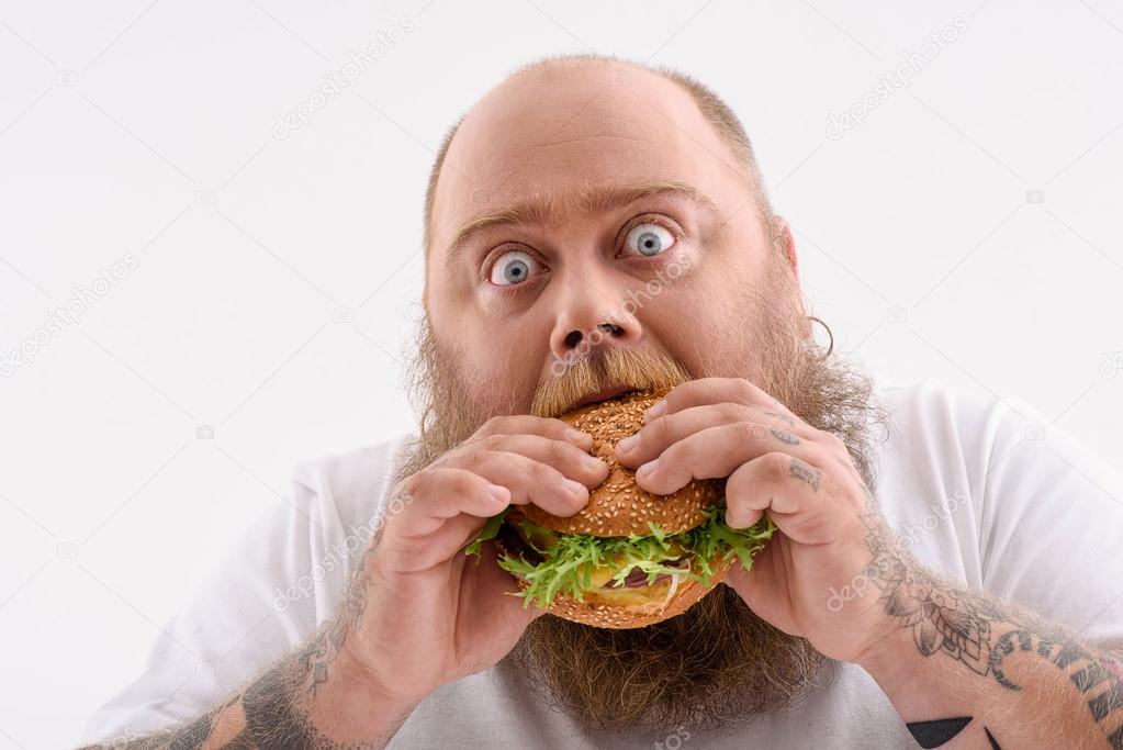 Fat Guy Eating Unhealthy Food Stock Photo By ©iakovenko123 119820792