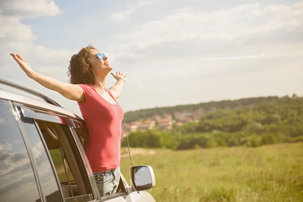 Beautiful girl traveling by car — Stock Photo, Image