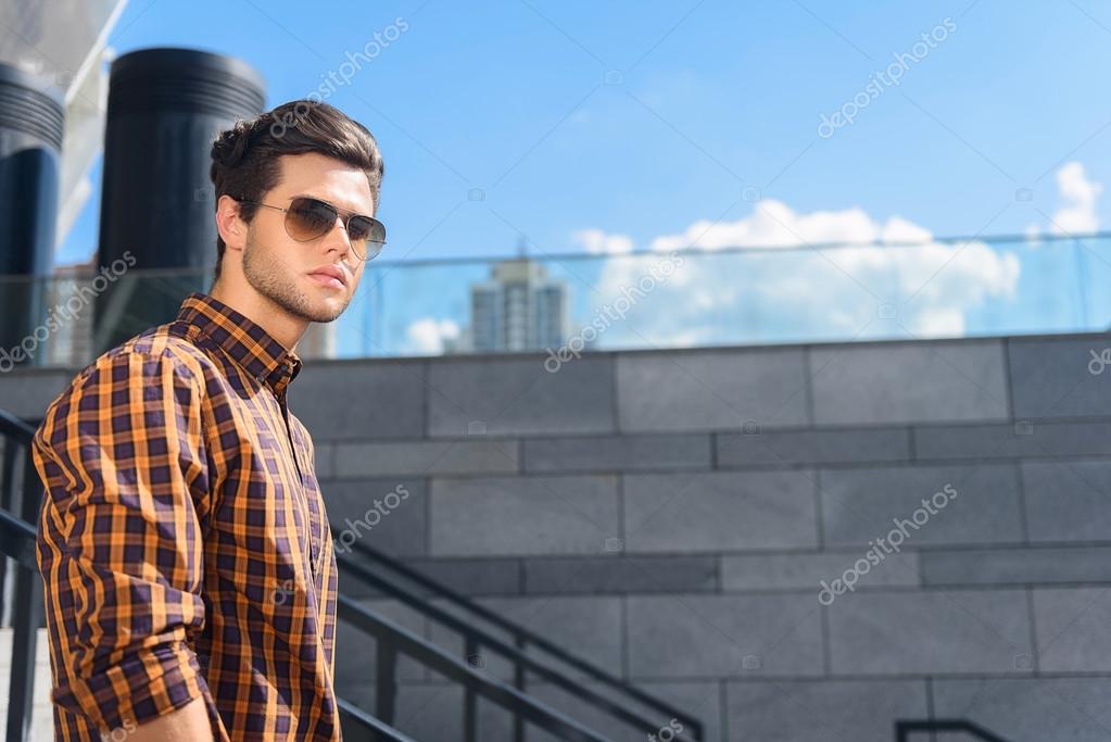 Serious guy going down stairs — Stock Photo © iakovenko123 120525078