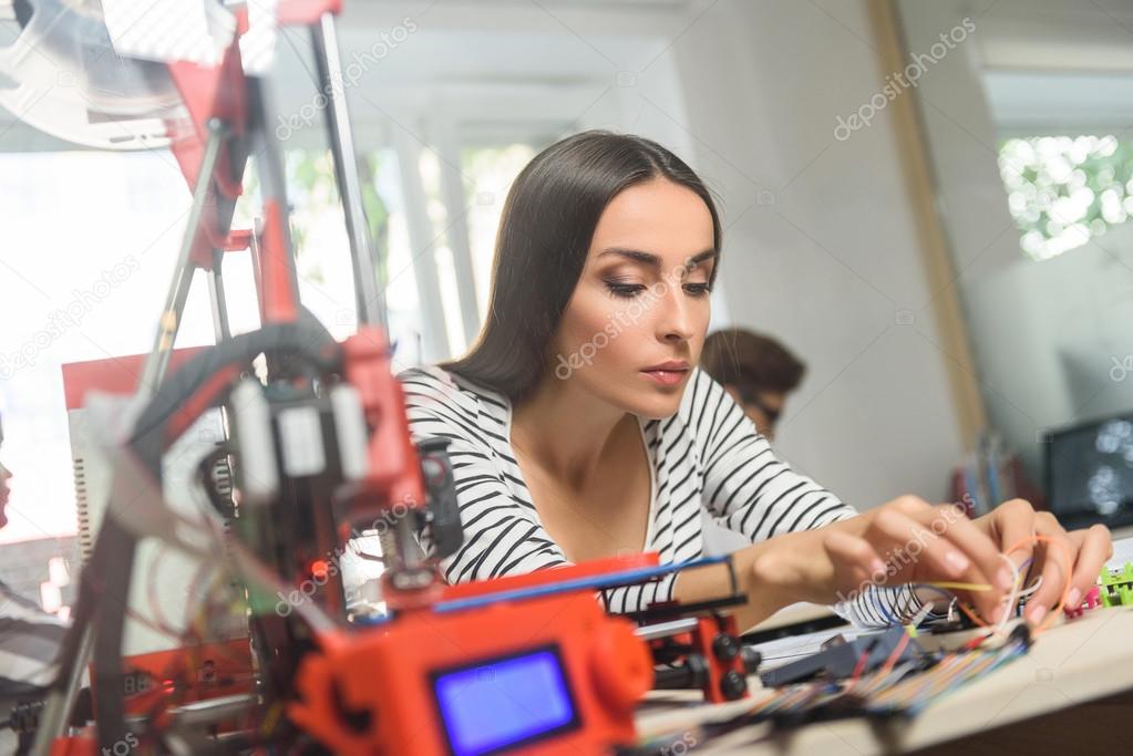 Cheerful young woman working with 3d technology