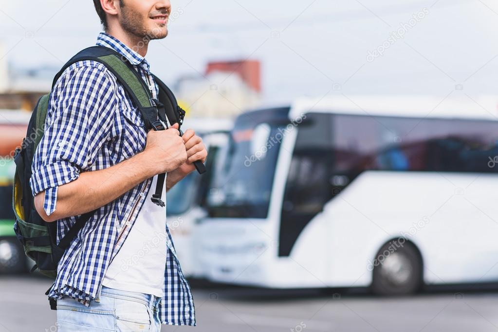 Cheerful male tourist ready to travel