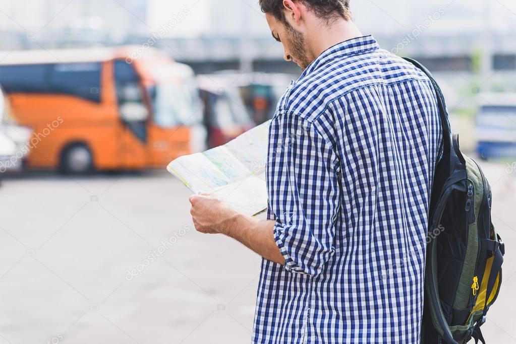 Thoughtful male traveler preparing for trip
