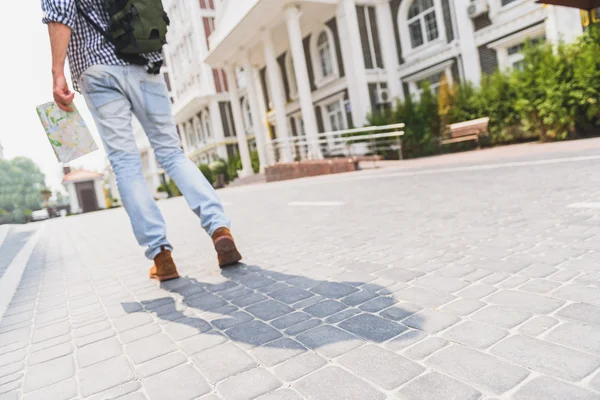 stock image Touristic young man walking in city