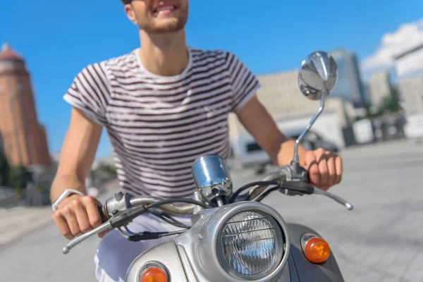 Happy guy traveling by motorbike