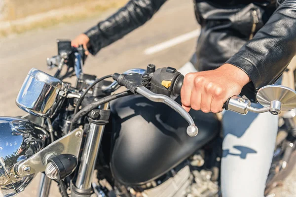 Young man sitting on his motorbike