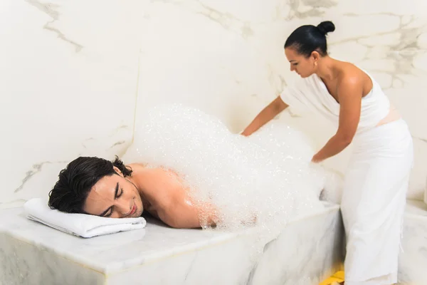 Young man enjoying treatment in sauna — 스톡 사진