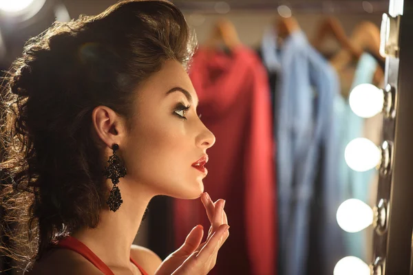 Attractive young woman preening in dressing room — Stock Photo, Image