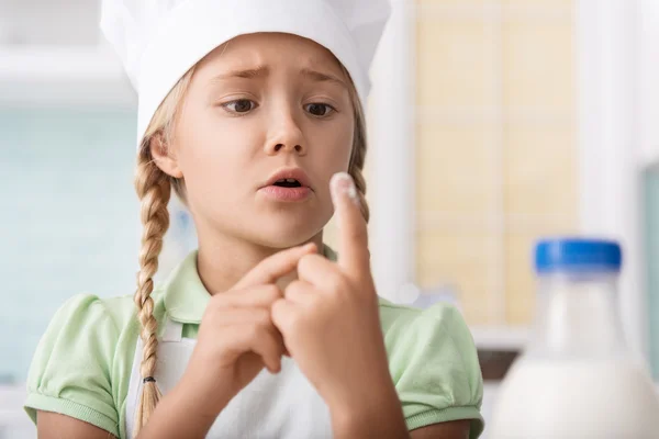 Pretty kid baking at first time — Stock Photo, Image