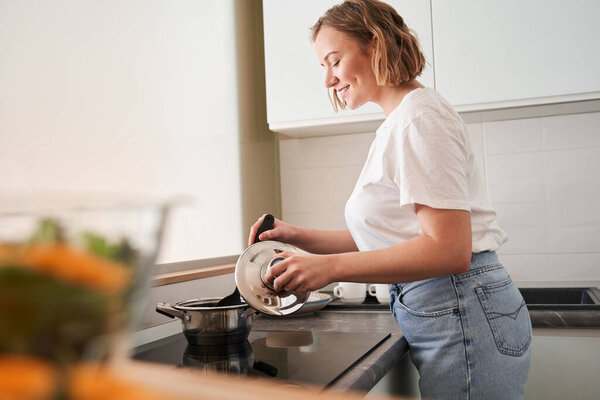 Woman stirring soup