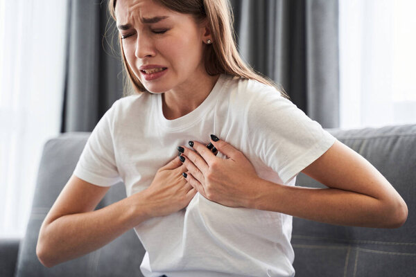 Woman suffering from heart attack