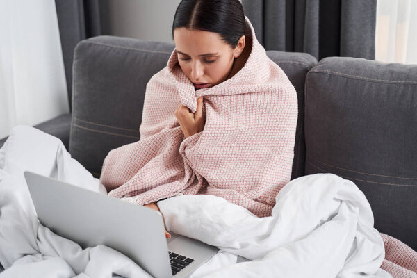 Woman relaxing with laptop computer