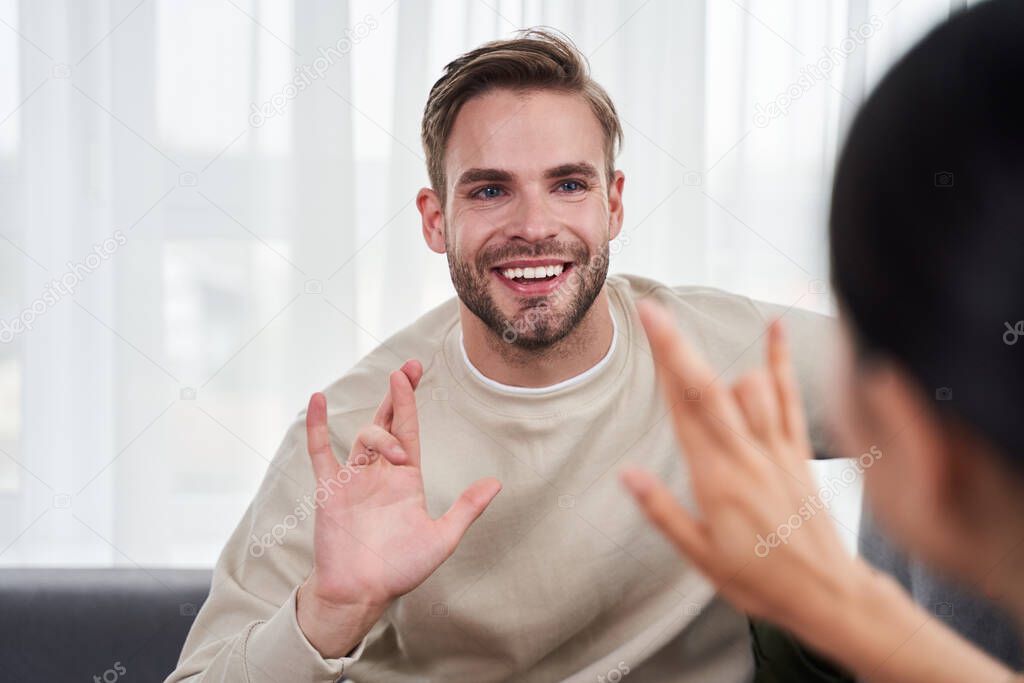 Couple communicating with sign language