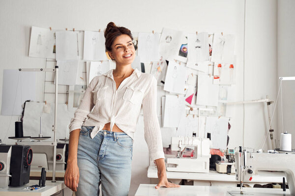Woman standing near her desk