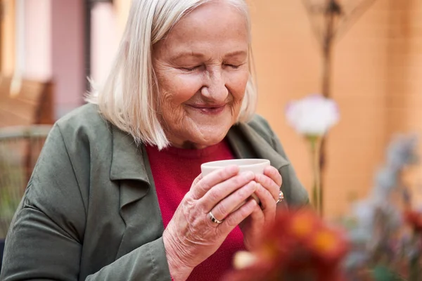 Woman sitting with closed eyes — Stock Photo, Image