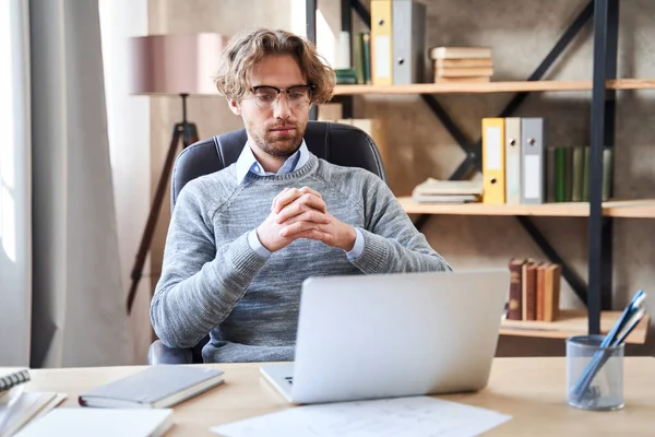 Businessman sitting at table with computer — Stock Photo, Image