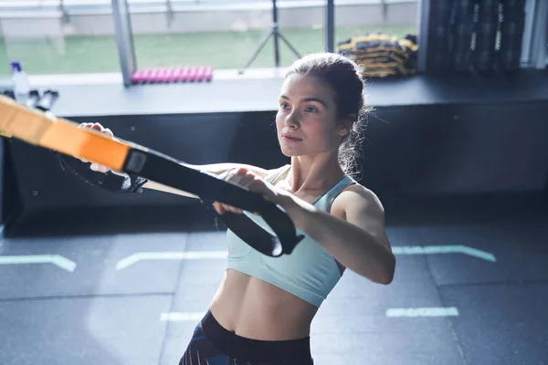 Calm women training arms in activity centre