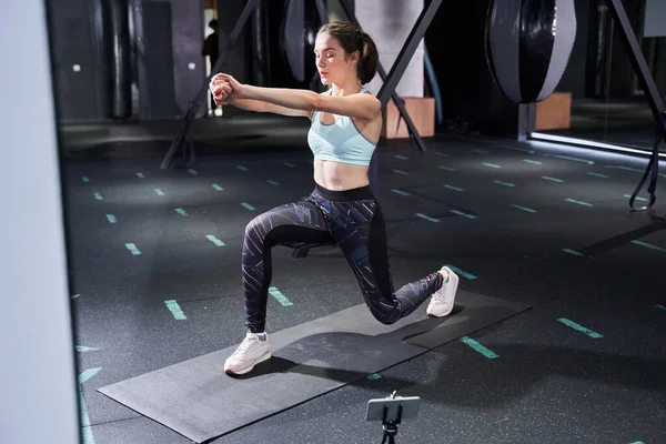 Woman doing lunges exercises for leg