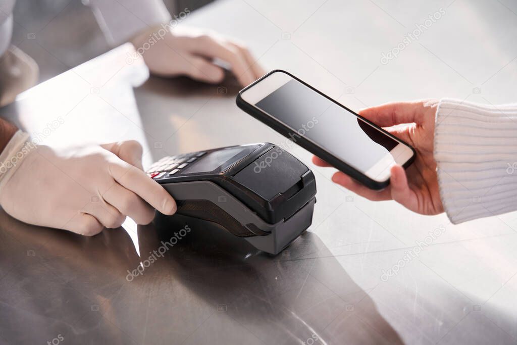 Customer making wireless or contactless payment