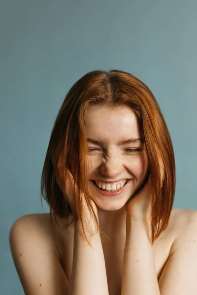 Woman with beaming smile holding her hands near her face — Stock Photo, Image