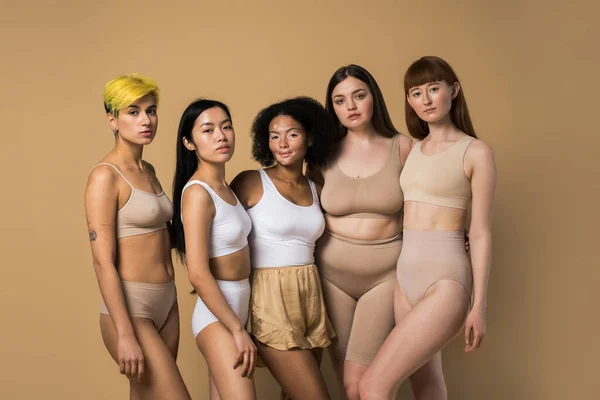 Women with different body and ethnicity posing together