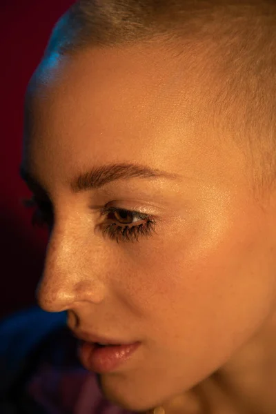 Woman with freckles and brown eyes looking away with serious emotions — Stock Photo, Image