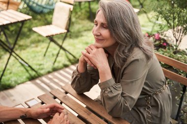 Woman looking with tenderness at her husband while enjoying of they romantic date