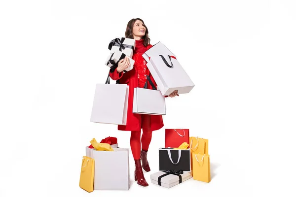 Woman shopaholic standing and holding bags with purchases — Stock Photo, Image