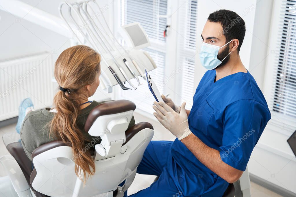 Doctor telling something to his female client