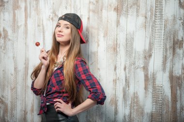 Cheerful Hipster woman with hat and candy clipart