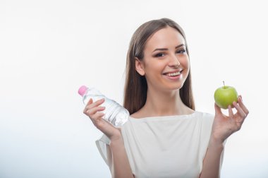 Pretty healthy girl with bottle of water and apple clipart