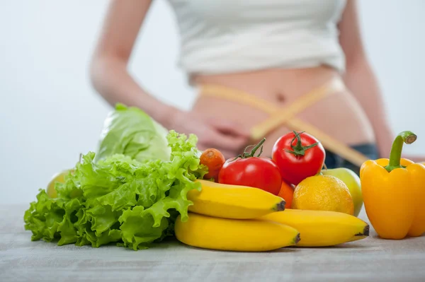 Healthy woman is trying to measure herself — Stock Photo, Image