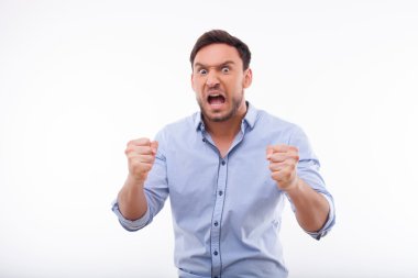 Irritated young man is expressing his negative emotions