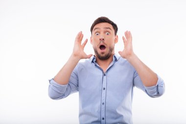 Emotional young man is very shocked and surprised