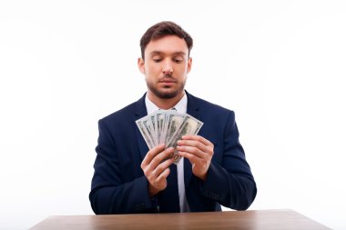 Handsome young man is calculating his savings