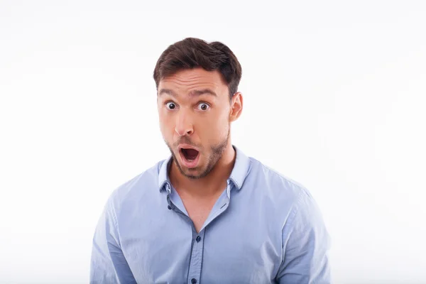 Handsome young guy is showing his amazement — Stock Photo, Image