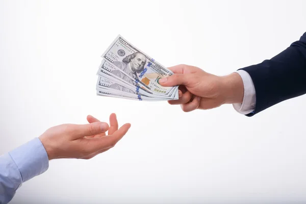 Rich young businessman is proposing big bribe — Stockfoto