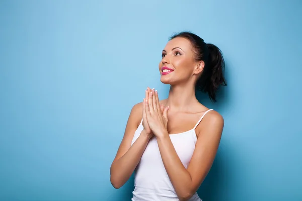 Attractive young woman is praying for good luck — Stock Photo, Image